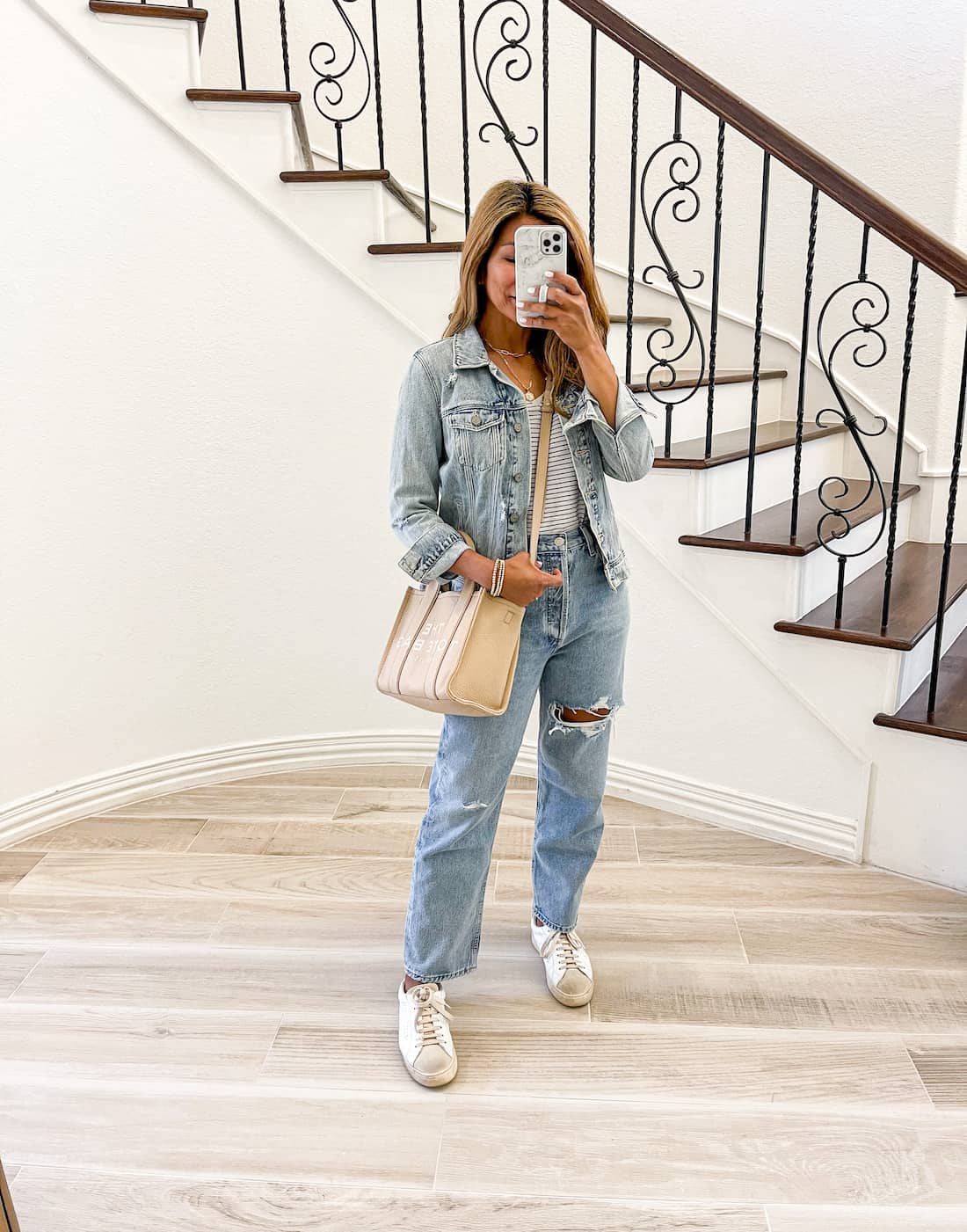 https://www.elvieinthecity.com/wp-content/uploads/2022/04/20220405-spring-outfit-striped-tee-denim-jacket-white-sneakers-marc-jacobs-tote-bag.jpg